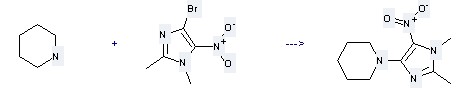 1H-Imidazole,4-bromo-1,2-dimethyl-5-nitro- can react with Piperidine to get 1-(1,2-Dimethyl-5-nitro-1H-imidazol-4-yl)-piperidine
